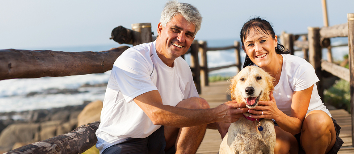 Sporty middle aged couple and pet dog