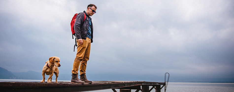 Man standing on wooden dock