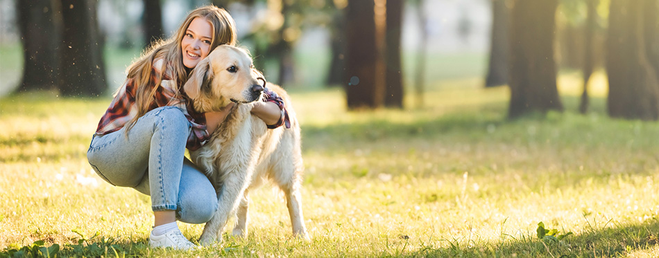 Woman hugging her dog