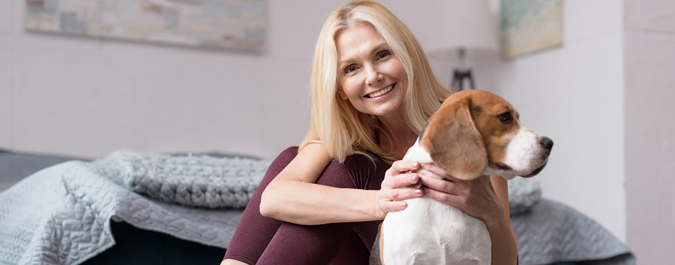 Woman with dog at home