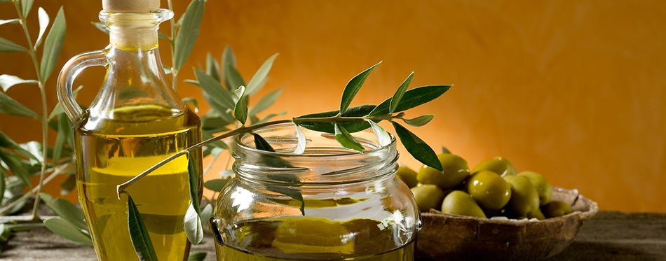 Olive oil on wood background 